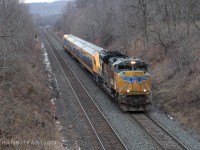 CN P27691 20 with UP 8577 on the point, Ontario Northlander TS1 (cab car 939-932-931-engine 930) in tow bound for VIA TMC, rushing through east end of CN Dundas sub towards Aldershot yard where Sarnia crew finished their trip and Aldershot crew will take over for the final miles on Oakville sub after work block lifted at Etobicoke tonight. (2025/12/21)