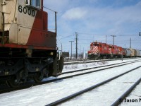 SOO Line SD60 6000 patiently waits to enter CP’s Toronto Yard in Scarborough, Ontario and meets a hump set heading out with another cut of cars to sort. The train had previously come off the MacTier Subdivision at West Toronto and had SOO 6000, HATX 513, MRL 222, 5821 and 5610, while the hump set had 1519, 1602 and 6713. 