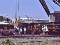 <br>
<br>
The Toronto Auxiliary CP Rail 414501 is cleaning up a couple of paper product boxes,
<br>
<br>
At CP Rail Don Mills crossovers mile 204.1 Belleville Sub., July 1987 Kodachrome by S.Danko
<br>
<br>
 More
<br>
<br>
 <a href="http://www.railpictures.ca/?attachment_id=  58176">  primer Hi Rail </a>
<br>
<br>
CP Rail 414501 is  a 250 ton capacity wrecking crane serial 11729 built 1946 by Industrial Brownhoist, now at St. Constant PQ (thank you Paul O'Shell).
<br>
<br>
sdfourty