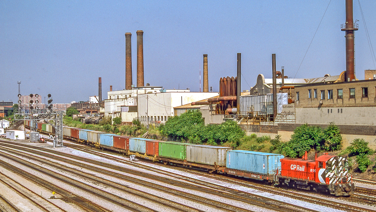 A CP SW1200RS pulls what looks like a seemingly almost-endless string of containers on July 30, 1987 in Toronto.