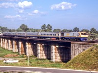 VIA 6905 is crossing the Ganaraska River in Port Hope, Ontario on August 8, 1985.