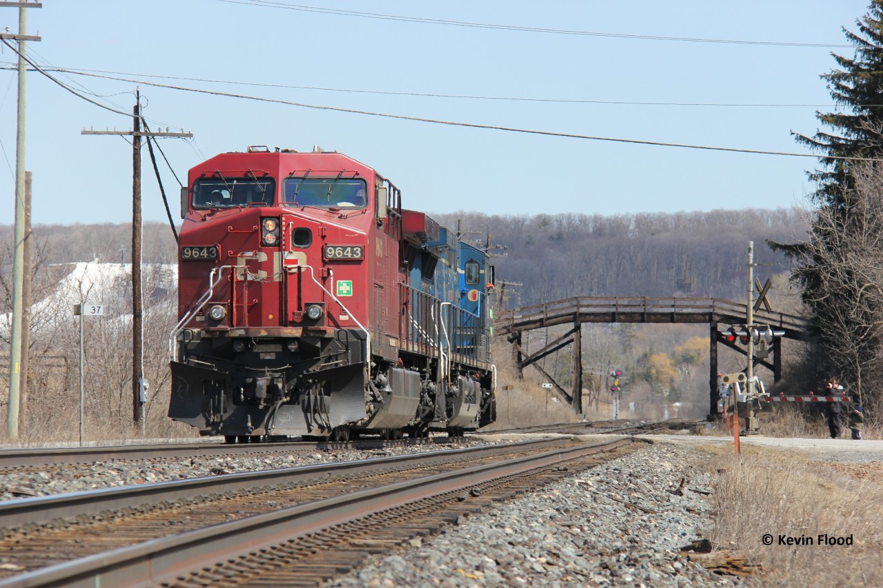 One of my favourite spots on the Galt Sub for shooting trains is Campbellville as it is relatively scenic. Pictured is a light power move consisting of CP 9643 and CEFX 1042. I believe this pair was used to help another train as I recall it came off a westbound autorack train (possibly CP 147 at time). A keen eye will notice some younger rail photographers to the right.