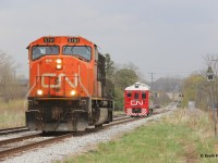 The CN test train, which typically runs as CN 1501 solo, was equipped with a 6-axle unit (same as when they were operating in 2024). The train ran east to Kitchener with the 5791 long-hood forward. It did not proceed east from Kitchener. Instead it went back west. The original plan was to put the 5791 on the other end of the RDC at Kitchener yard but the crew couldn't get a hold of 568, which was working the yard at the time. Instead they went as far east as Sturm and then went back west, utilizing the rarely used siding track at Baden to move the engine so it was nose facing west. Meanwhile, the sun begins to fade from incoming thunderstorms on this warm late April day.