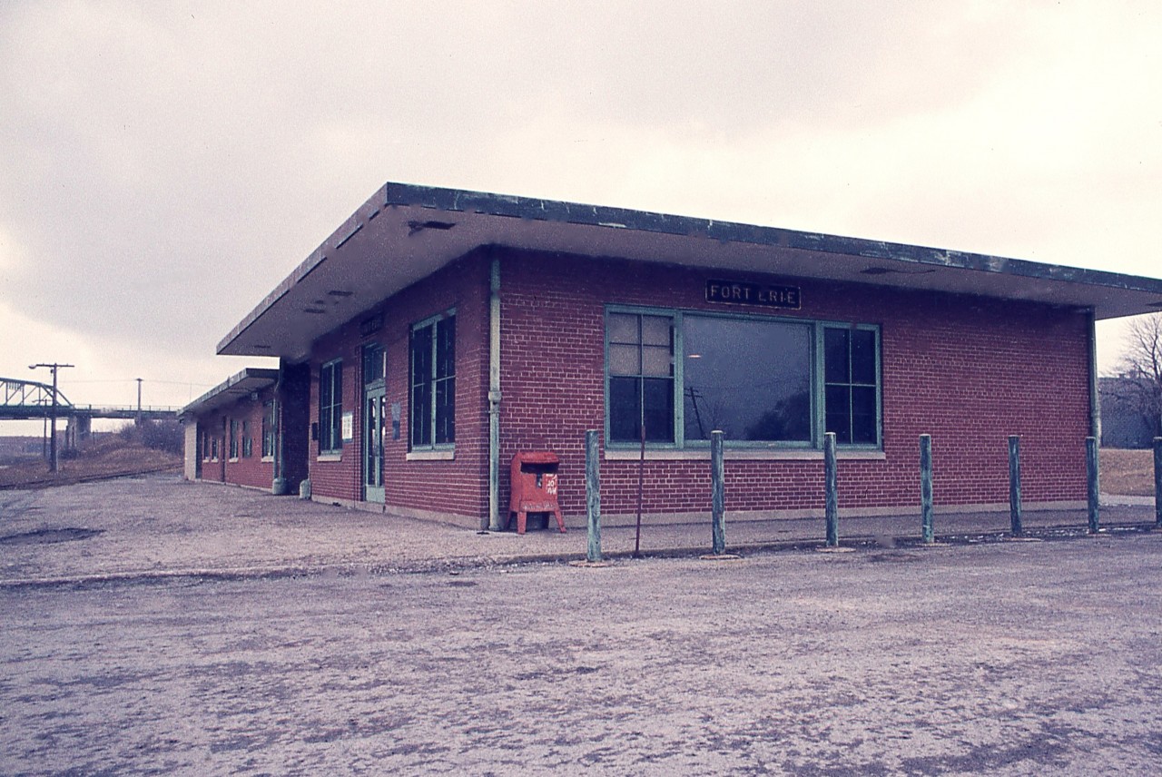 Continuing on with station photos....  This one was familiar with many fans; the old MCRR/TH&B station at Fort Erie. It was known by most photographers as that modern (1949) boarded up brick building that sat abandoned on the north side of the tracks near the International Bridge.  Once the TH&B dayliners ceased operation in spring of 1981, the building outlived its usefulness.  It was demolished in 2000.
Note the newspaper box for the Globe and Mail.  The price was 10c per copy. It is now $5.25. !!!