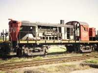 When I got into this hobby, these locomotives were nowhere to be found.........except in a scrap line. At least this photo is better than nothing.  Here is MLW RSC-13 #1709 pretty much cannibalized and waiting out the scrapper at the London East reclamation yard. And yes, I got a souvenir. One lone bolt. :o)