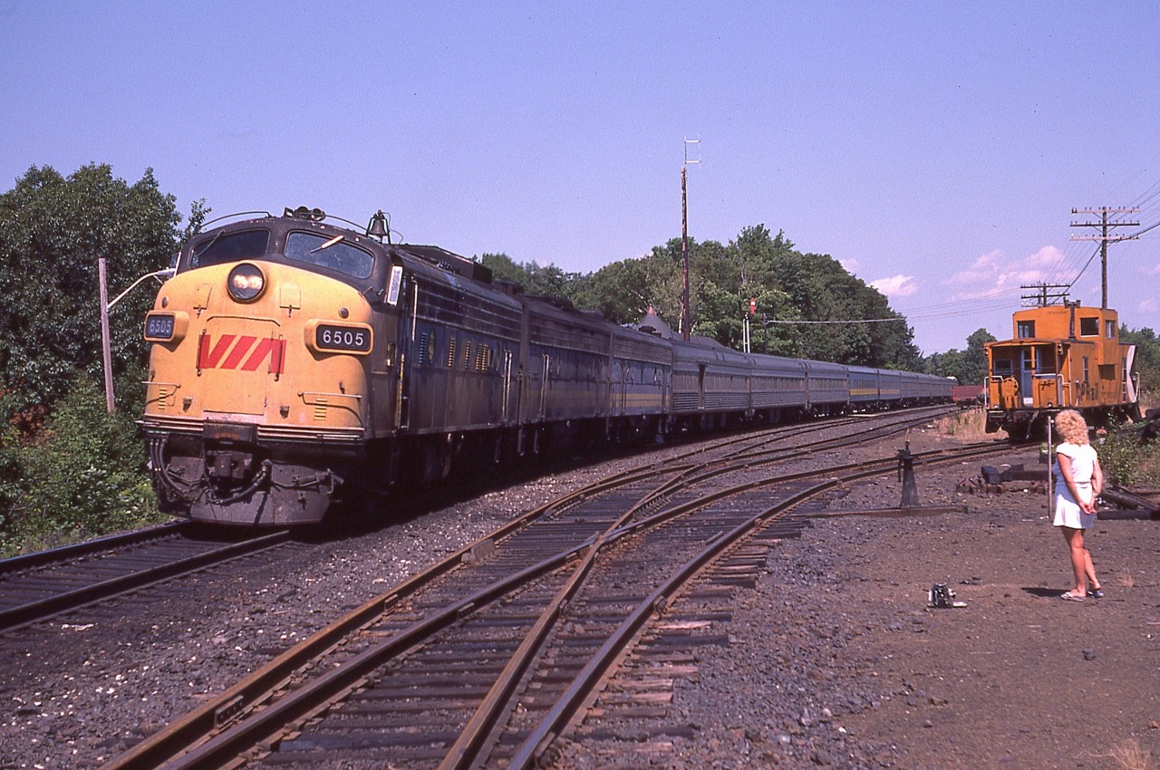 The dedicated sidekick of the day checks out the VIA as well as keeping an eye on the Speed Graphic on the ground as I wander around getting shots of the Toronto section of the Canadian stopped at the CP station. Power up front is VIA 6505, 6632 and 6622. This image is from a slide.