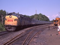 The dedicated sidekick of the day checks out the VIA as well as keeping an eye on the Speed Graphic on the ground as I wander around getting shots of the Toronto section of the Canadian stopped at the CP station. Power up front is VIA 6505, 6632 and 6622. This image is from a slide.