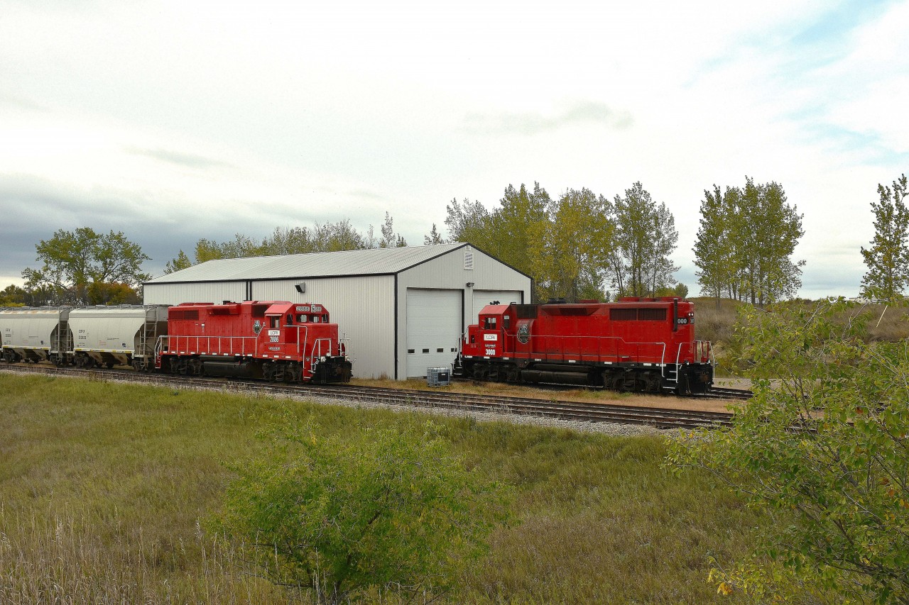 The Long Creek Railroad began operations officially in 2012, running over 41 miles of the former CP Bromhead Sub track from Estevan out westward to the hamlet of Tribune.  The image shown is of their two leased units, 2886 and 3000 alongside a relatively new engine house.
I drove out to Tribune in hopes of seeing more. Nope. The track had an uneventful dead end, with rusted rail that looked like it hadn't seen a train in months.
Apparently there are two major grain operations that the LCRI services along the way, and that is about 90% of their business.
It certainly was frustrating to locate this engine house considering I really did not know where to look. Down on the dead end of an industrial road off the main highway #39 is a gravel laneway and a very small sign. The shop is down over the hill and not visible from the road.  But in the end, definitely worth the hassle.