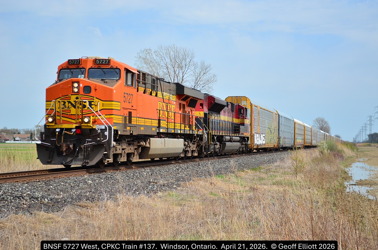 With a heads up from several guys further east on the Windsor Subdivision I was able to catch today's CPKC #137 as it approaches Banwell Road crossing, just east of Walkerville, on the CPKC Windsor Sub.  Today's power is BNSF ES44AC #5727 and KCS SD70ACe #4142 somewhat mimicking yesterday's 137 which had CSX #7115 and a KCS unit.  Nice seeing some of foreign power leading again westbound on the Windsor Sub.
