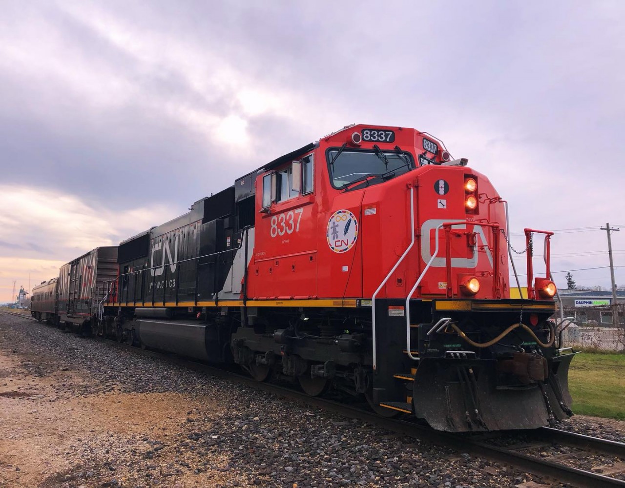 CN 8337 pulling the DGRMS Test Car and TEST Track Evaluation System through Dauphin to points west along the Togo Subdivision.