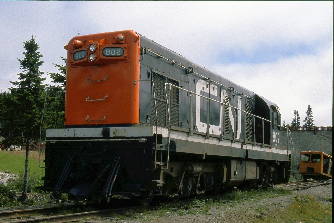 Just two days after his wedding, the photographer was enjoying his honeymoon at the Trinity Loop Park and exploring all the attractions it offered. Former Terra Transport G8 locomotive 802, one of 3 of the 6 that was preserved following the shutdown of the Newfoundland Railway, was a delight to behold. Built in 1956 by GMD of London, the 875 horsepower unit with narrow gauge A-1-A trucks was a perfect match for the the Argentia, Carbonear and Bonavista branchlines of Newfoundland and served admirably for 30 years. This particular unit had the distinction of leading the first diesel hauled train over the 88 mile Bonavista branch on March 27, 1956 as well as the last lead unit on its final on November 23, 1983.The Trinity Loop, built in 1911, was the only visible railway loop in North America and it too was preserved. As for the 802, it was sadly scrapped in the 2000's after the park shut down, leaving only sisters 803 in Carbonear and 805 at Exporail. Fortunately, 802 and all her siblings can be seen in action in my latest, BRANCHLINES OF NEWFOUNDLAND, released by Seaweed Publishing of Newfoundland.