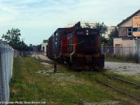 CN 549 with CN SW1200RS 1346 working at GM Ontario Street plant.