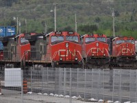 All lined up and nowhere to go!!!!  From left to right: 2692 on the intermodal, 2585 on the general freight, and 5693 on the Sudbury turn are all lined up and waiting their turn to depart from Capreol yard on May 24, 2011. 