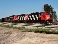 It was June 1989 and happily the unit train still looked much like it had for many years. The re-built units, the 4006 and 4004 on this occassion, blend right in with the older 4332. The older units rarely ran first up anymore, this being the usual setup, old timers in the middle. This train returned early Wednesday at 5:20 with the 4004 leading and 35 loads of sulphur.