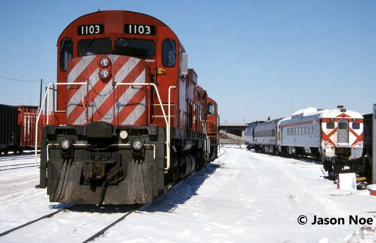 CP Control Cab 1103 (former C-424 4206) and GP9u 8224 are waiting for their next assignment as CP RDC-2 91 and another RDC languish near the caboose shop at CP’s Toronto Yard in Scarborough, Ontario. Eventually 91 was sent to western Canada where it was stored at CP’s shops in Calgary for possible future restoration. Ultimately, the railway found a new home for it at the Alberta Central Railway Museum where it was renumbered back to its original number 9108 and operates there today.