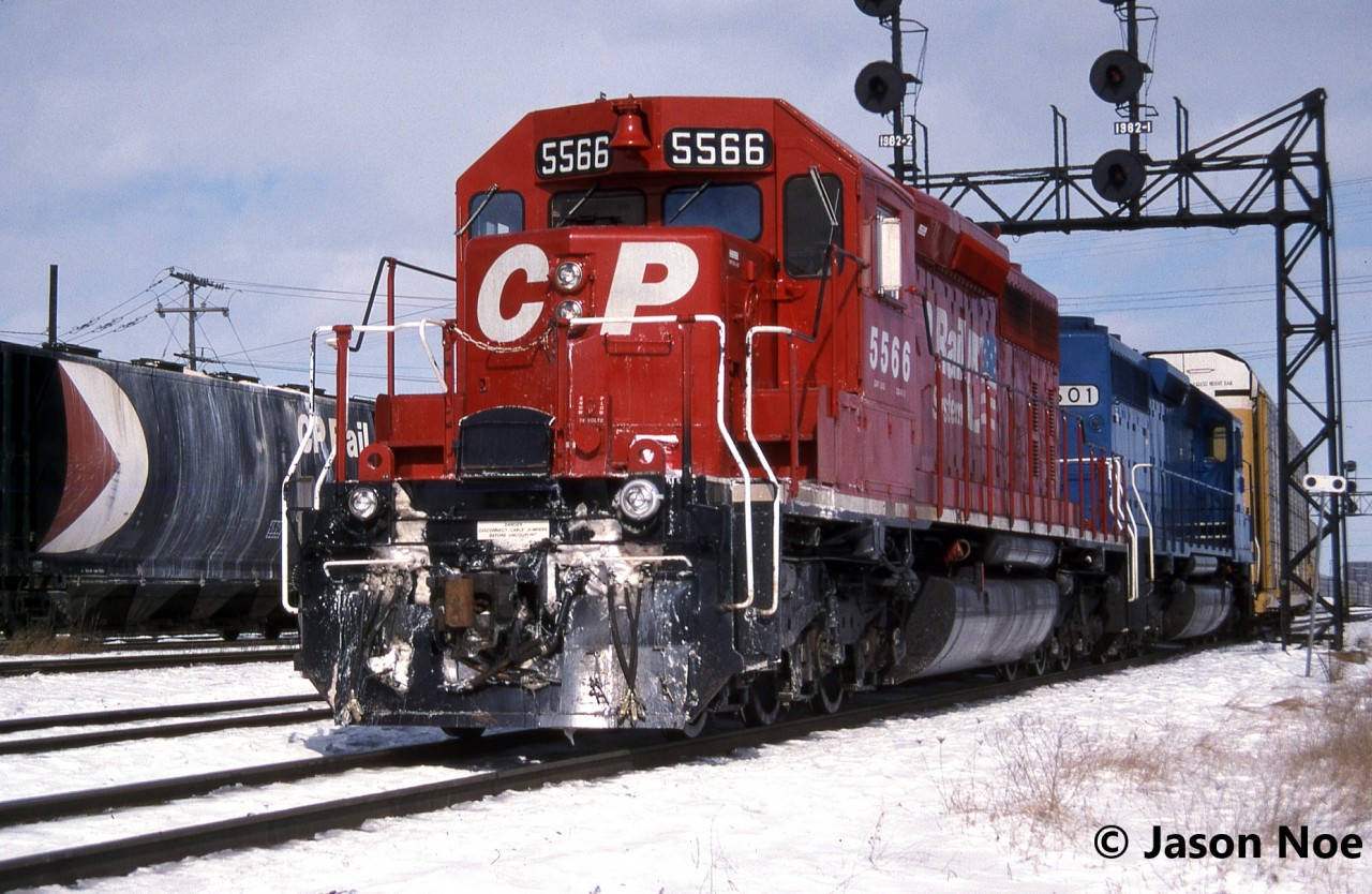 A westbound CP auto train with SD40-2 5566 and Conrail Leasing (CRL) SD40 601is viewed departing Toronto Yard in Scarborough, Ontario for the Galt Subdivision. CRL 601 was ex-CR 6293 and nee-PRR 6040.