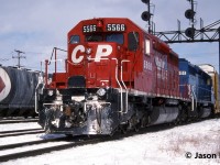 A westbound CP auto train with SD40-2 5566 and Conrail Leasing (CRL) SD40 601is viewed departing Toronto Yard in Scarborough, Ontario for the Galt Subdivision. CRL 601 was ex-CR 6293 and nee-PRR 6040.