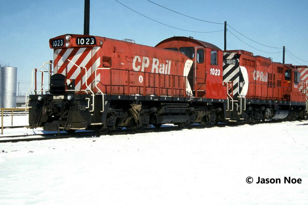 CP Slug 1023 and GP9u 1610 are pictured waiting between pull down assignments at CP’s Toronto Yard in Scarborough, Ontario. Slug 1023 was built as SW1200RS 8116 and eventually rebuilt in 1985 as SW1200RSu 1272.

Here is a photo of the pair working the yard in later years.