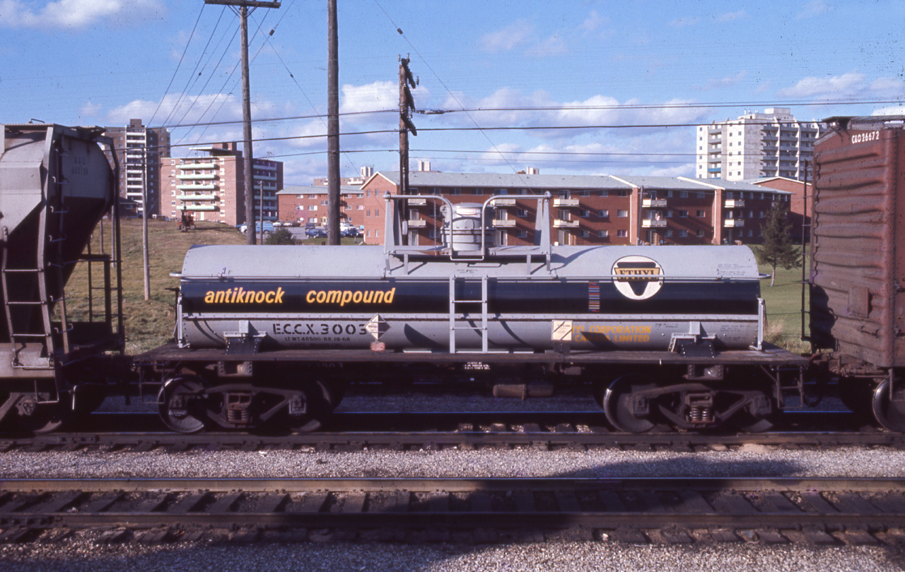 What I can only guess as London (where the estate was located) and having him been an occasional railfan of the London area, this Eythl Canada tank car looks right at home.

A wonderful write up from Geoff Elliott on these (https://actionhobbiesrailroad.wordpress.com/2015/05/11/geoff-elliott-on-modelling-ethyl-anti-knock-tank-cars/#jp-carousel-1058) helped narrow down either where this was going to, or from. 

Eythl Canada had a plant in Corunna, Ontario from 1956-2013 when the plant was closed. Eythl had a rather modest roster of roughly 60 tank cars of different capacities. 
https://www.theobserver.ca/2013/10/30/another-business-closure-adds-to-mounting-job-losses-in-sarnia-lambton

Our subject is the smaller of the lot, rated at 3,000 Gallons with 9 tank cars rostered of this style.

Thanks again to Jacob Patterson for scanning these