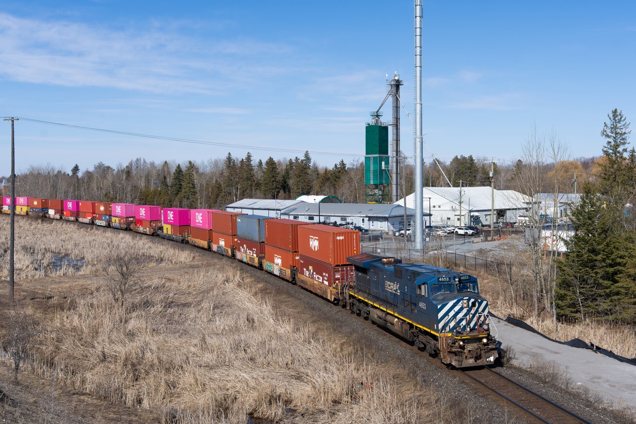 BCOL blue Dash 9 4653 leads a truncated Q102 south through Mt. Albert enroute to BIT on a sunny March afternoon. Due to things getting a little hectic up north on the Ruel Sub due to trains dying in the sub-zero temperatures, Capreol at the time was chock-full of intermodal trains split up into blocks, awaiting an opportunity to continue south pending power and crew availability. This no.102 was quite short, only a few thousand feet in length, punctuated by CN 2697 on the tail end (the locomotive what was previously the mid-train DP), that somehow had it's bell left on, ringing all the way down to Toronto from up north.
