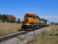 The sunny weather and colourful set of units brought a hoard of foamers out this day.  Bobbing by the farm at mile 26 of the Fergus Spur, 540 cruises down to Gillies Lumber.
