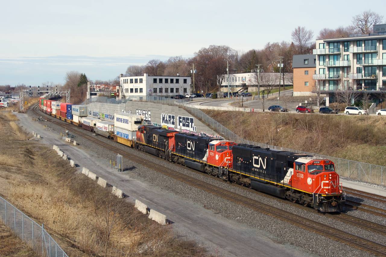 CN 120 is heading east with two SD75IACCs up front and an ES44AC third (CN 8308, CN 8315 & CN 2819).