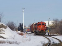 CN YRP002 with CN 7272 leading has just set off tank cars in Carrière Yard as CN 593 lurks in the background. 