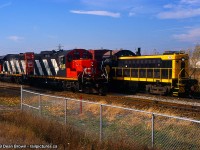 Merritton was a busy spot back in 1999 after Trillium Railway had taken over all the CN trackage in St. Catharines and Thorold. or CN ran 564 from Niagara Falls to Merritton to do the Interchange with Trillium for a short term. After a few weeks, the Interchange was transferred to Feeder. 

PCHR 308 waits for its cars on the south track of the CN Grimsby Sub while CN 564 is setting out and lifting cars on the south side.