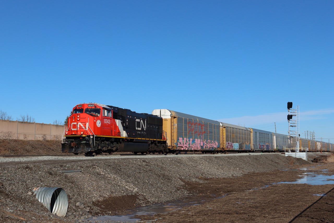 Westbound CN 8343 (Ex-CN 5744) with all auto racks through Derry over the "construction switch" installed on March 23 2026. The left hand #20 turnout will provide access to and from the future south track between Ash and Derry.