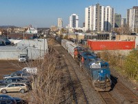 Often referred to as “blueberries”, the GECX tier-4 emission demonstrator ET44AC locomotives are seldom seen to be leading around Southwestern Ontario with their lack of PTC. I’ve taken a liking to these, as they remind me of the ‘Blue Devils’ which are all retired now. On the rare occasion that one is assigned trailing on 435 the day before, there’s a pretty good chance it will lead the local 509 the next day. Here it is seen bringing 509 towards London yard at Adelaide Street on the Dundas Sub.
