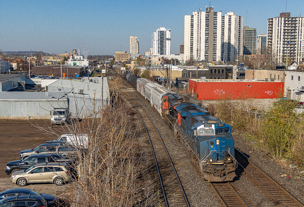 Often referred to as “blueberries”, the GECX tier-4 emission demonstrator ET44AC locomotives are seldom seen to be leading around Southwestern Ontario with their lack of PTC. I’ve taken a liking to these, as they remind me of the ‘Blue Devils’ which are all retired now. On the rare occasion that one is assigned trailing on 435 the day before, there’s a pretty good chance it will lead the local 509 the next day. Here it is seen bringing 509 towards London yard at Adelaide Street on the Dundas Sub.