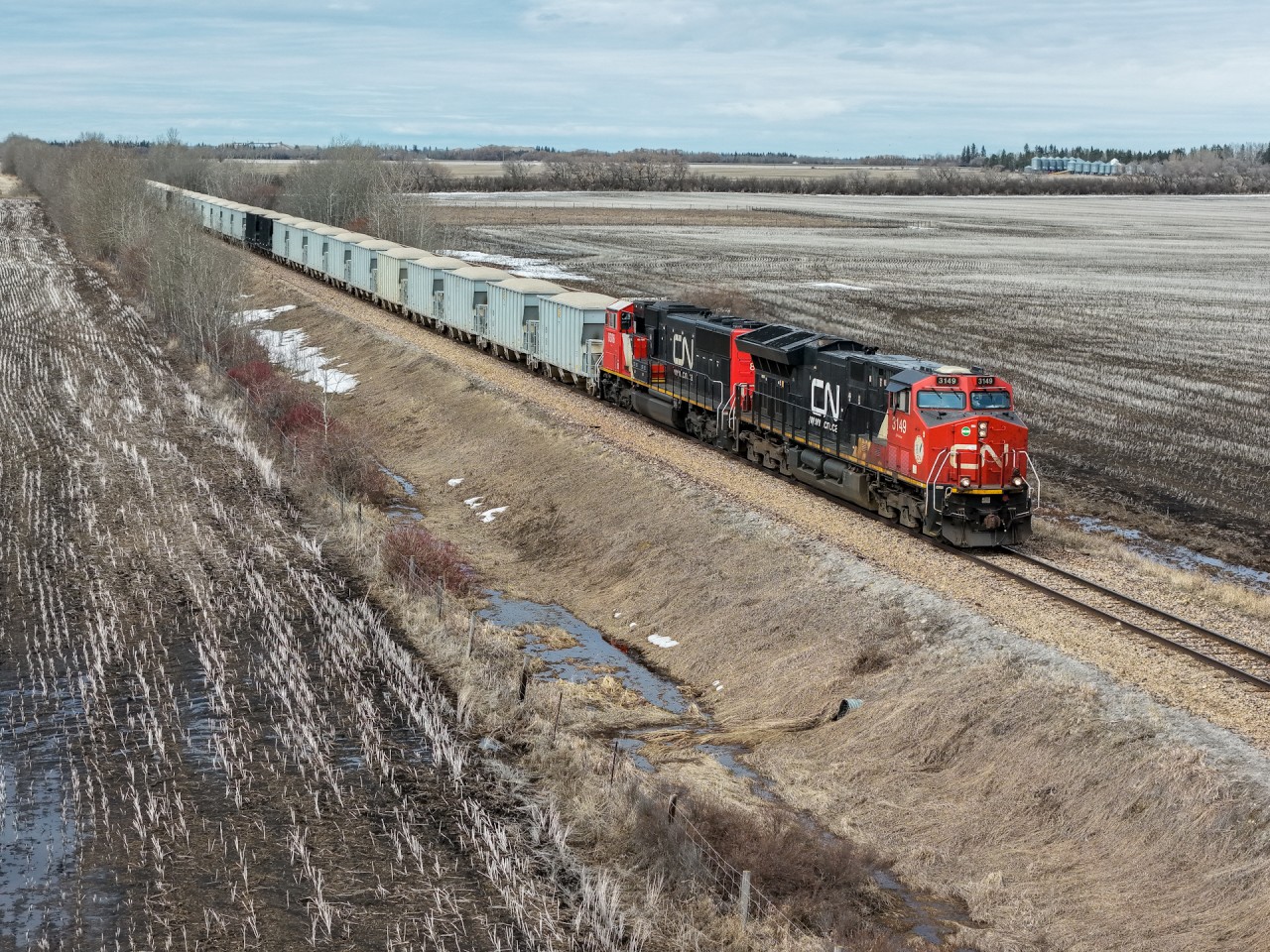 The first Standard General aggregate train of the season rolls into St. Albert, bound for the processing plant in Acheson.  This train only operates during the spring and summer months between the Silver Creek mine located west of Whitecourt and typically runs in a distributed power configuration, which helps with the shove move from Bissell to Acheson on the Edson Sub.  Aggregates are a fairly lucrative business for CN in the Edmonton area with three different unit trains operating.  The RROX set runs from a mine near Benbow, also on the Sangudo Sub to a plant at Clover Bar and the Cadomin trains run year round from the Mountain Park spur to Bissell.