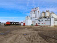 L 52151 18 cruises past the Morinville Seed Cleaning plant with CN 5350 leading. 