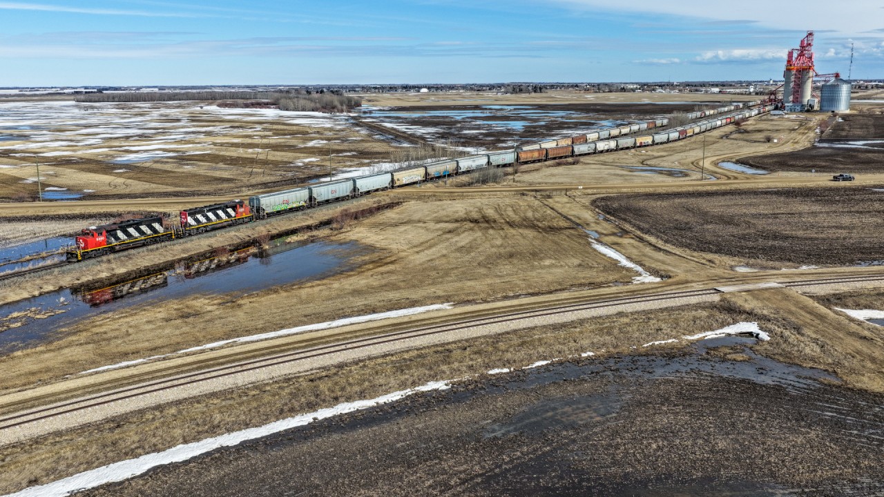 CN L 52151 18 spots Morinville Pioneer with CN 5350 and CN 5305.  The train departed Edmonton with 165 cars and carry on up the old NAR mainline to Westlock with 67 for WTI.
