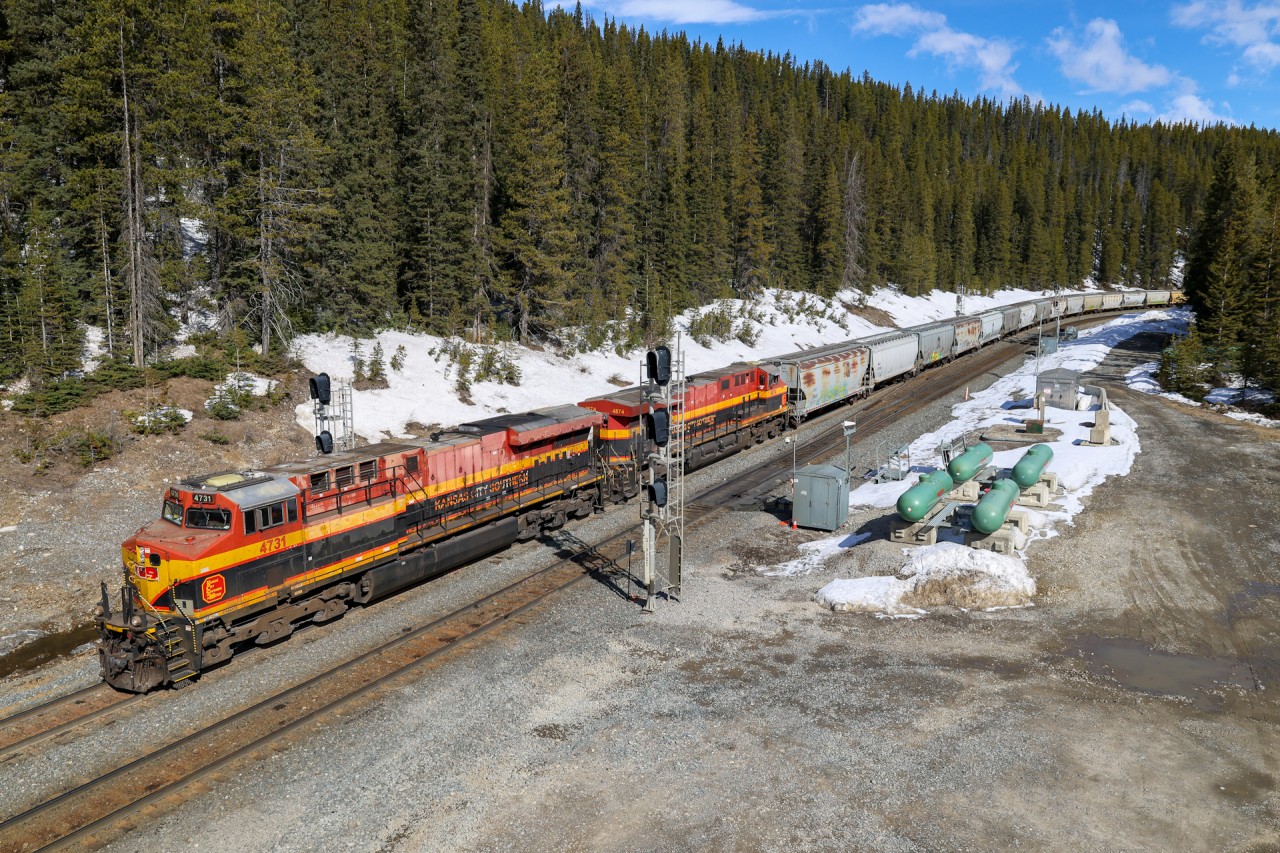 The battle with gravity is halfway over, as CPKC 301-438 crests the Continental Divide with a pair of KCSM units on the headend.  The second half of the battle will be descending Kicking Horse Pass on the 2.2% grade - but only after holding at Stephen for a five eastbound parade!