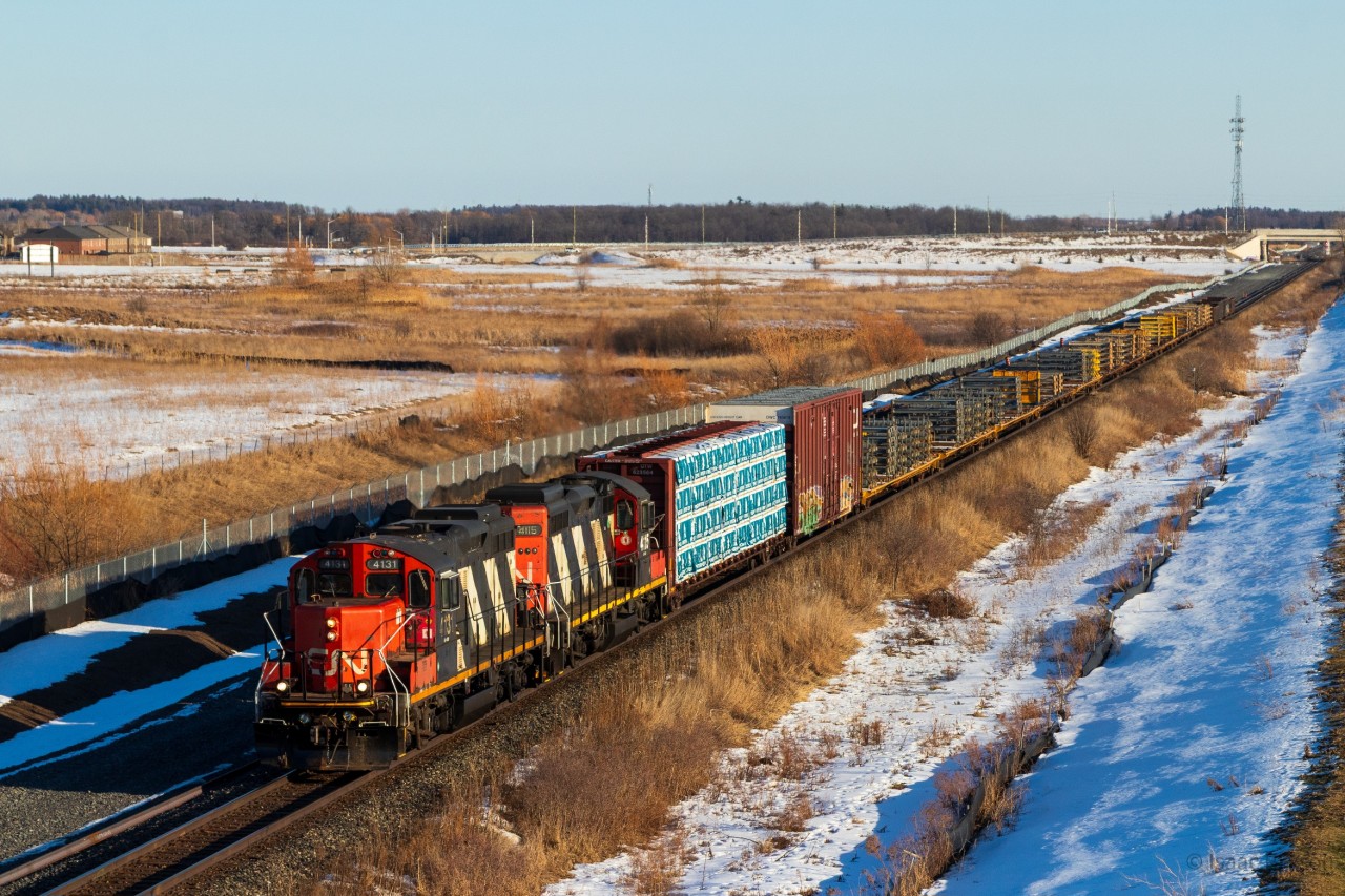 CN L551 heads north (timetable east) up the Halton at restricting speeds following a 394 in front of them. Power is CN 4131 & CN 4115, matching zebra GP9RMs. CN 4115 recently returned to the Toronto power pool after spending the better part of the last decade in Montreal. As far as CN locals go, I don't think you can top a duo like this in 2026. Both units are approaching 70 years old, a wild sight for a class 1 railway.