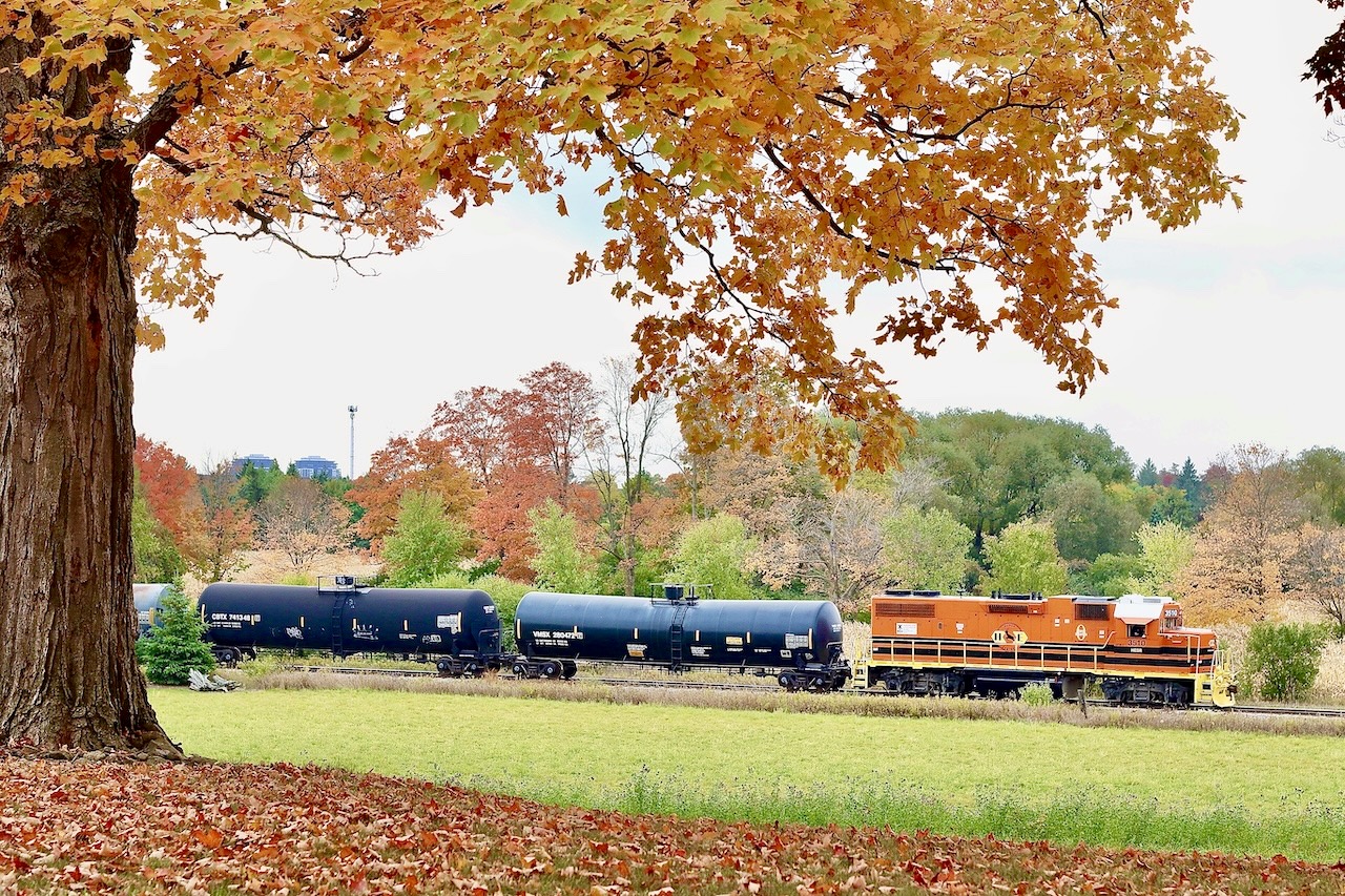 One of those locations I’ve always liked photographing over the years in the fall. Unfortunately sunny days don’t work for this angle so often I found myself making g the trip up the Guelph Junction Railway on bright but overcast days, at least for the morning northbound trip. During 2022 GEXR operations were in need of some additional power to fill in for ailing units and freshly painted/overhauled Huron Eastern GP38 3510 was quickly rerouted to the GEXR. The four exhaust stacks give away its Mo-Pac heritage. In the autumn I’ve always liked photographing the colourful trees on the hill just north of Arkel, with the train in the distance.