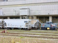 This was the only time I saw this centre cab critter shootable. The shot was through the fence and today the weeds and bushes are too high on the other side of the fence to get any photos, not to mention the unit is rarely in an open space. This was St, Lawrence Cement’s Mississauga operation but now has been rebranded as Holcim. The plant is regularly switched out by CN with the little swicher used to move cars around only inside the facility. 