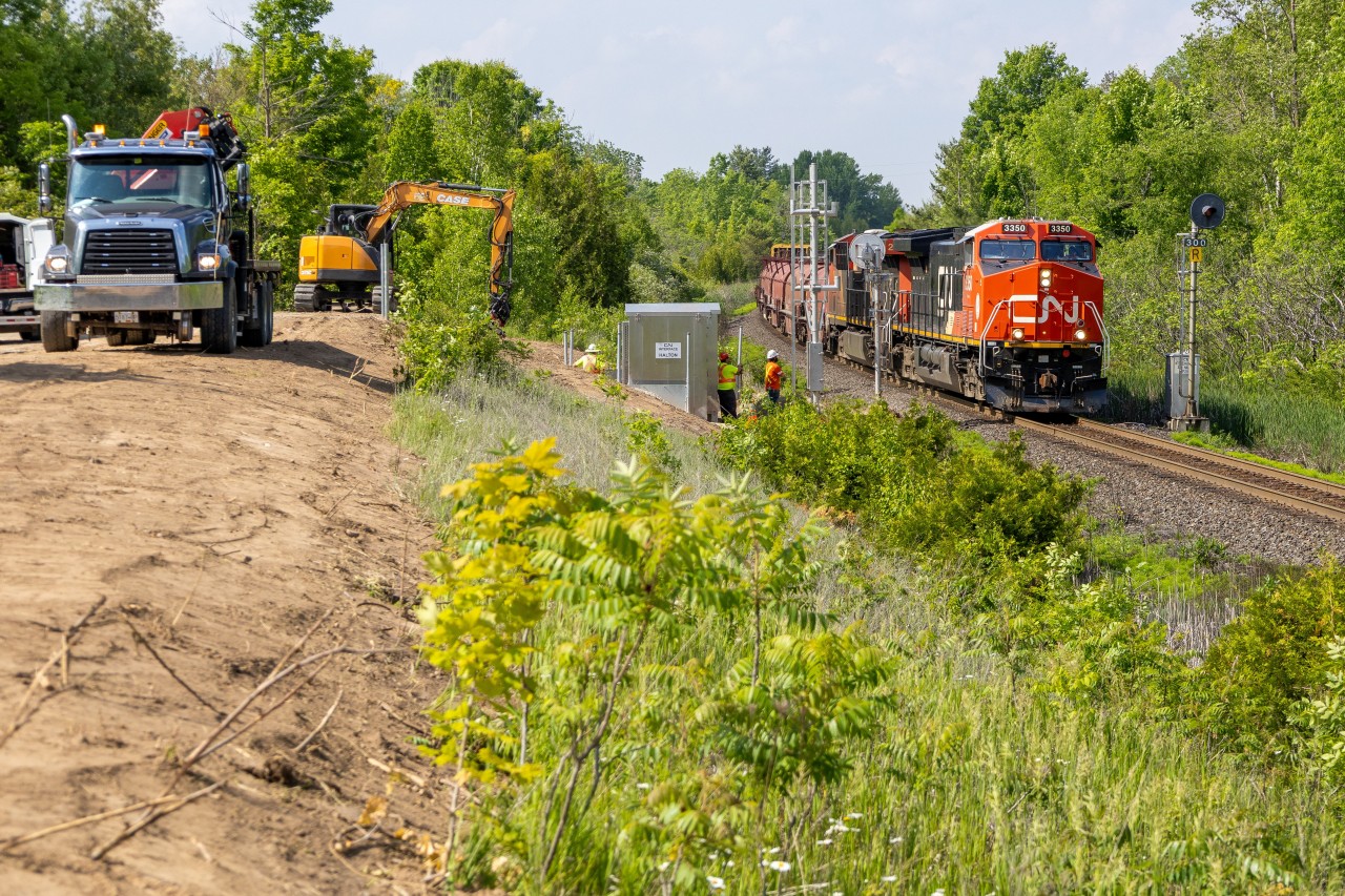 Changes...

It is very sad how often once well known locations across Ontario can be ruined so quickly. Not only was this a spot where many railfans could shoot 1960's era searchlights, It was also a quiet and safe spot to hang out while not having to worry about trespassing or unwanted "people".

Now, neither is the case anymore and it's unfortunate. For those who do not know, recently some railfans who were at this spot got threatened with a 600$+ fine by CN Police for just standing on the gravel/dirt road (at the left of the pic). Apparently that is CN's property even though there aren't any signs or fences in front of the dirt road saying this.

This was my first and probably last time shooting this location, but what I have heard from many other railfans was that they have never gotten bothered by CN for railfanning here and even that this short road was owned by the City of Halton. Well I don't think this is the case anymore.... Railway police should really be putting in effort inside of their own yards keeping watch of people who actually steal valuable railway equipment instead of harassing innocent railfans who just want to enjoy some trains. Feel free to comment about this because I want your opinions! I could be talking out of my rear end here ????

Enough ranting, for those who stuck around, here is the Halton's finest L570 with a new C6M leading going by some foreman setting up new Vaders for the approach Speyside/Mansewood Control Points.