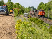 <h2><strong>Changes...</strong></h2>

<p>It is very sad how often once well known locations across Ontario can be ruined so quickly. Not only was this a spot where many railfans could shoot 1960's era searchlights, It was also a quiet and safe spot to hang out while not having to worry about trespassing or unwanted "people".</p>

<p>Now, neither is the case anymore and it's unfortunate. For those who do not know, recently some railfans who were at this spot got threatened with a 600$+ fine by CN Police for just standing on the gravel/dirt road (at the left of the pic). Apparently that is CN's property even though there aren't any signs or fences in front of the dirt road saying this.</p>

<p>This was my first and probably last time shooting this location, but what I have heard from many other railfans was that they have never gotten bothered by CN for railfanning here and even that this short road was owned by the City of Halton. Well I don't think this is the case anymore.... Railway police should really be putting in effort inside of their own yards keeping watch of people who actually steal valuable railway equipment instead of harassing innocent railfans who just want to enjoy some trains. Feel free to comment about this because I want your opinions! I could be talking out of my rear end here ????</p>

<p>Enough ranting, for those who stuck around, here is the Halton's finest L570 with a new C6M leading going by some foreman setting up new Vaders for the approach Speyside/Mansewood Control Points.</p>
