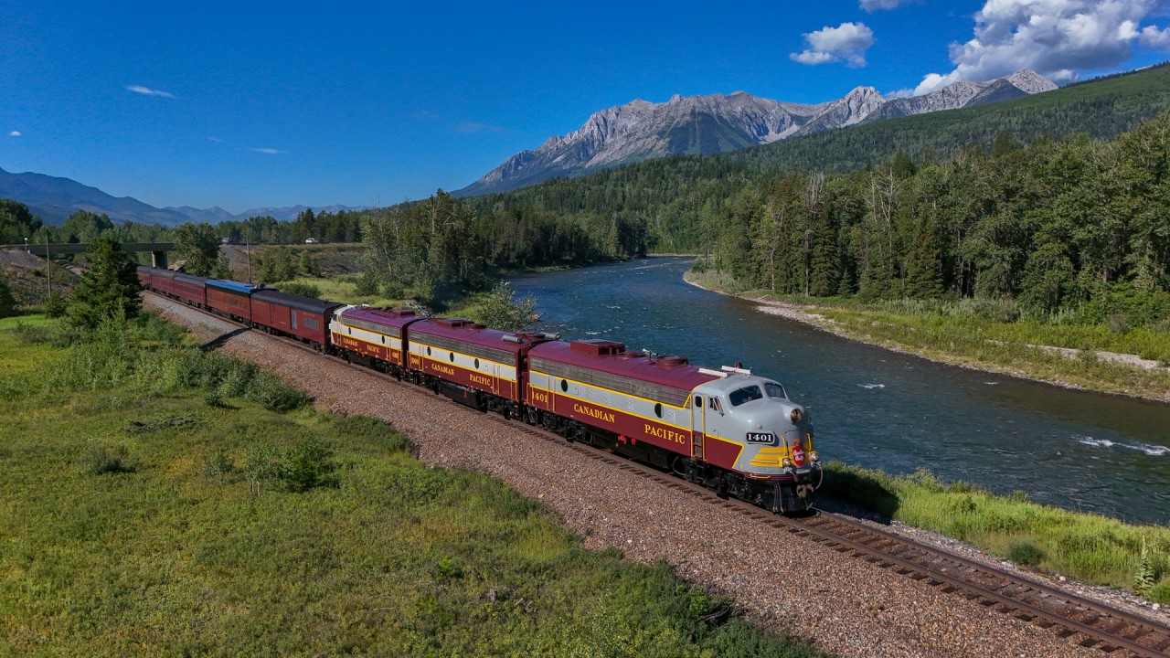 The Royal Canadian Pacific rolls along the Elk River as they approach Sparwood for a quick crew change before setting out over Crowsnest Pass.
