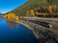 The fall colours are in full swing as the eastbound Canadian runs along the shore of Moose Lake. 