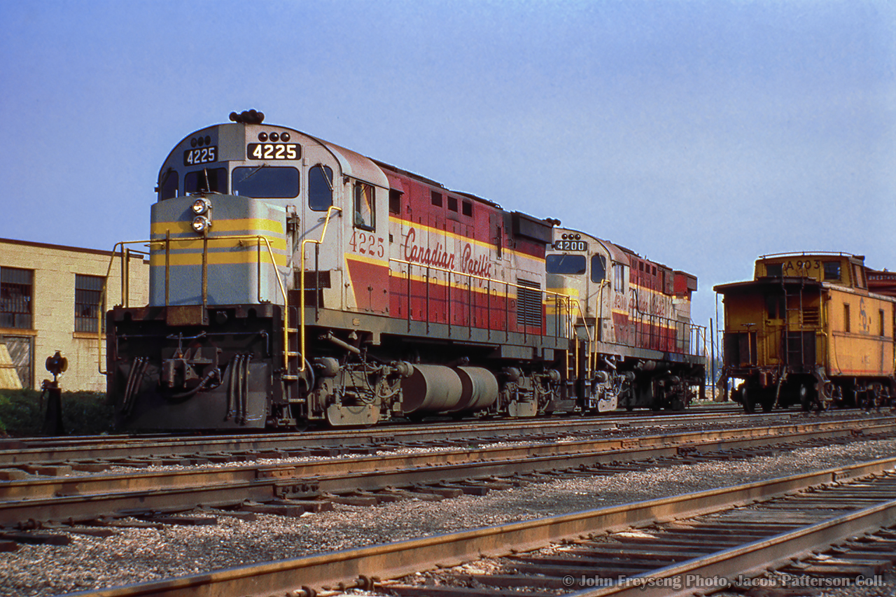 CPR C424s 4225 and 4200 are seen at Windsor Yard with C&O caboose A903 bringing up the rear of a tunnel transfer to Rougemere Yard in Detroit.  C&O 1801 and 5745 lead the transfer.

John Freyseng Photo, Jacob Patterson Collection Slide.