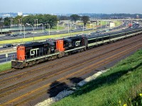 A pair of GTW GP9s lead train 156 through Sunnyside nearing their destination of Union Station.

<br><br><i>Scan and editing by Jacob Patterson.</i>
