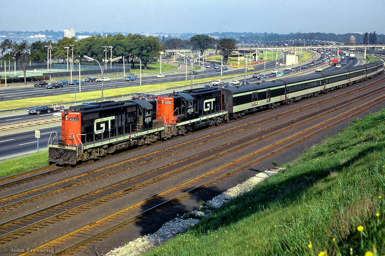 A pair of GTW GP9s lead train 156 through Sunnyside nearing their destination of Union Station.

Scan and editing by Jacob Patterson.