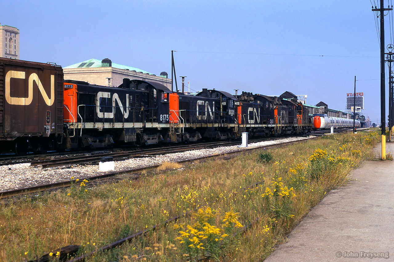 Eastbound around York street at the west end of Union Station, five switchers head up what is likely a transfer to Toronto Yard through downtown Toronto.

Scan and editing by Jacob Patterson.