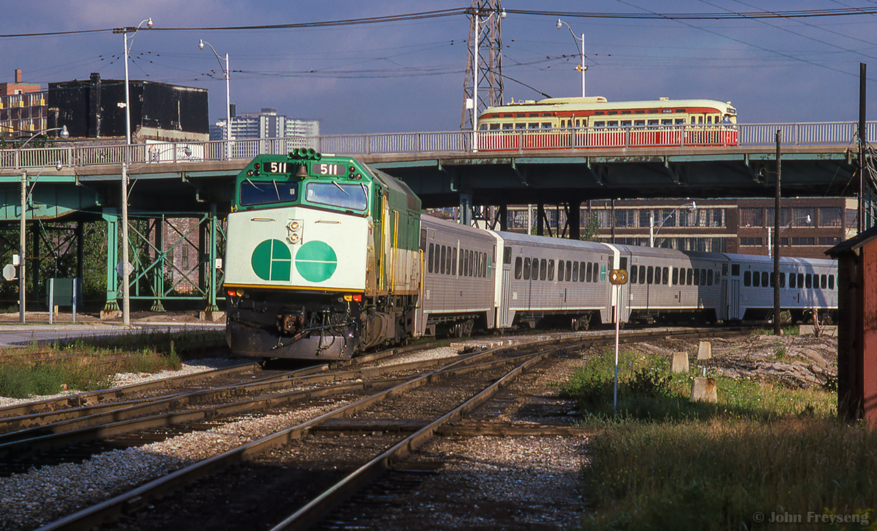 Rolling down the Bala Sub from Richmond Hill GO, a morning train nears Union Station passing beneath Queen Street.

Scan and editing by Jacob Patterson.