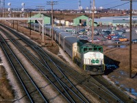 GO Transit 703 trails on an eastbound train arriving at Pickering GO.  APCU 901 leads.

<br><br><i>Scan and editing by Jacob Patterson.</i>