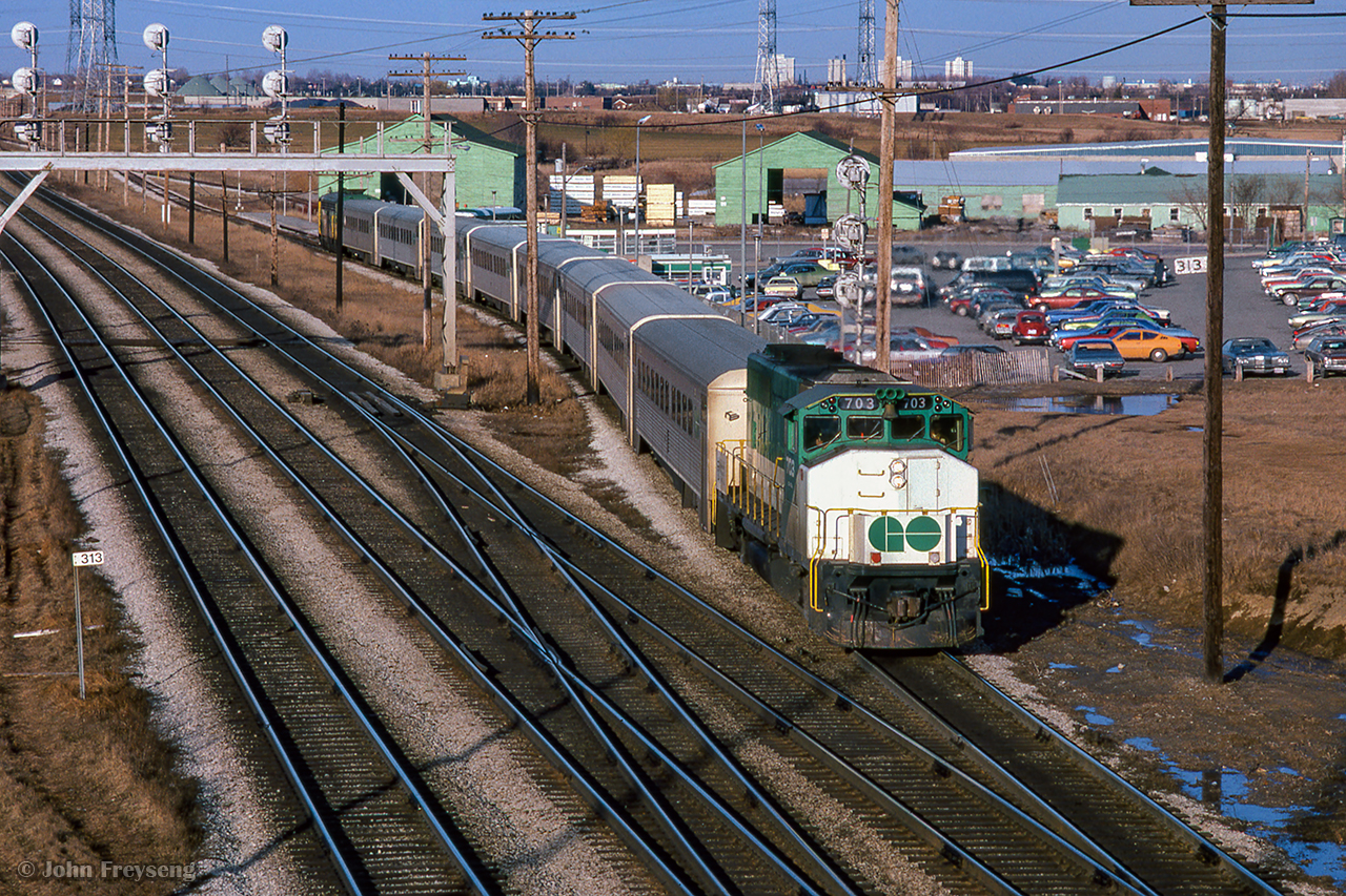 GO Transit 703 trails on an eastbound train arriving at Pickering GO.  APCU 901 leads.

Scan and editing by Jacob Patterson.
