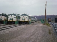 Three GO Transit consists tied down at Guelph Junction await their next runs to Toronto.  Off to the right, a pair of MLW RS18 units will be the power for the Guelph Junction road switcher.

<br><br><a href=http://www.railpictures.ca/?attachment_id=56684>Making up their train</a>
<br><a href=http://www.railpictures.ca/?attachment_id=56795>Departing for Waterdown North.</a>

<br><br><i>John Freyseng Photo, Jacob Patterson Collection Slide.</i>